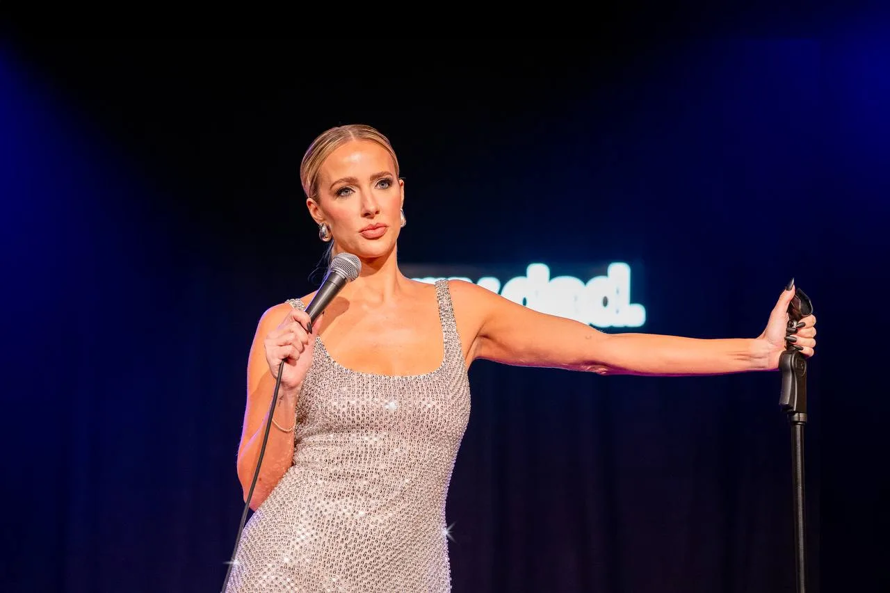 Brittany Schmitt on stage performing Sorry Dad